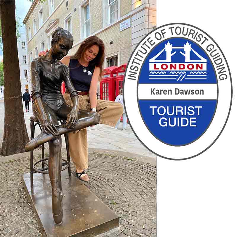 Karen Dawson emulating the pose of the Young Dancer statue in Broad Street with blue badge.